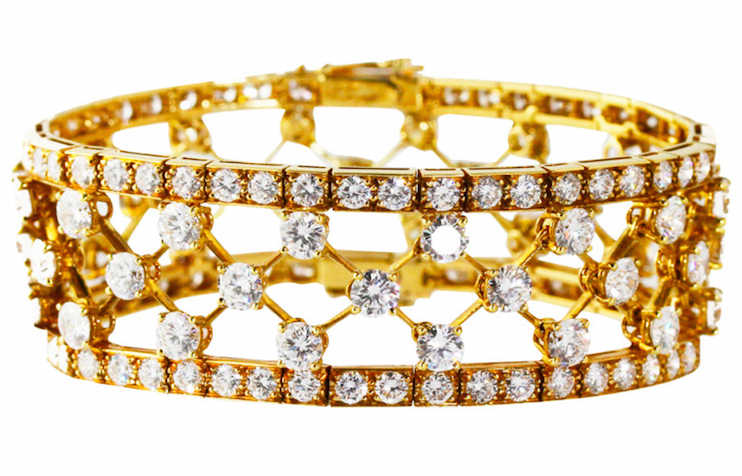 18 karat yellow gold 'snowflake' bracelet by Van Cleef & Arpels, designed as an openwork lattice design set with 144 round diamonds weighing approximately 25.00 carats, gross weight 46.9 grams, length 7 inches, width 7/8 inch, signed Van Cleef & Arpels, with French assay marks. Offered by J.S. Fearnley.