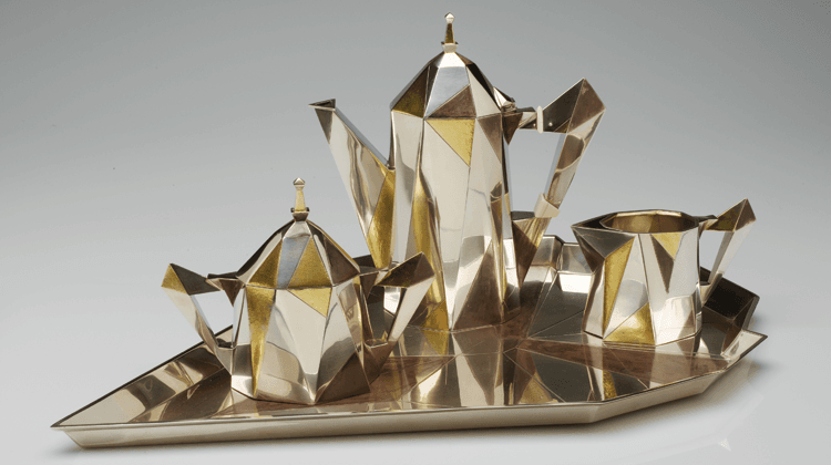 Fig. 3 Cubic Coffee Service, Erik Magnussen (1884–1961), designer, Gorham Manufacturing Company American (1831–present), 1927. Silver with patinated and gilt decoration, ivory. Coffeepot: h. 9 1/2 in.; tray: 21 1/2 x 13 3/8 in. Museum of Art Rhode Island School of Design, Providence, The Gorham Collection, gift of Textron Inc. (1991.126.488).