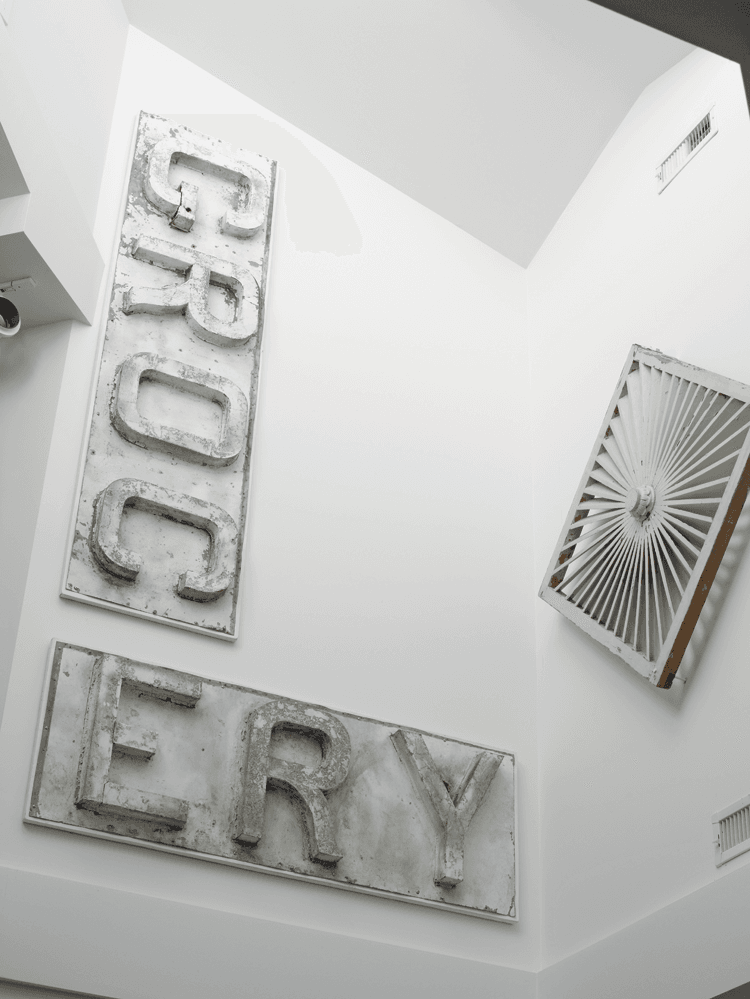 At nine feet in length, this tin advertising sign posed a potential problem for display. Says the husband, “I had an epiphany that, since it was in two pieces, we would hang it at angles.” As such, this mid-twentieth-century sign is given a new life as contemporary sculpture.