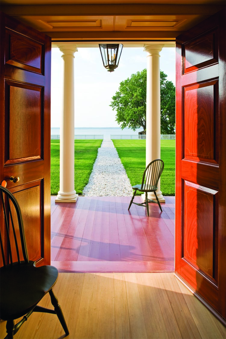 One of the favorite lounging areas for the Schorsches is the porch facing the James River. Off to the right can often be seen the Jamestown-Scotland ferry and the lights from historic Jamestown. An elaborate tree house can be seen beyond the gate.