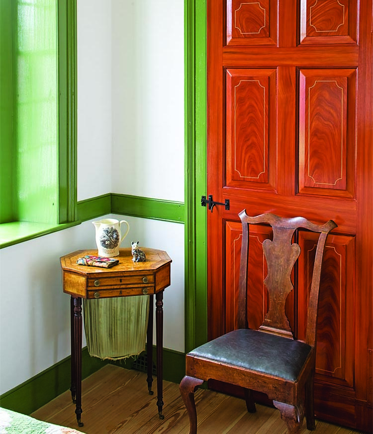 Rich surfaces are a major theme of the décor, with hand-ground pigments and mahogany-grained doors accenting many objects in the collection, such as this mahogany Philadelphia side chair (circa 1765) and satinwood veneered sewing table from Boston, circa 1800.