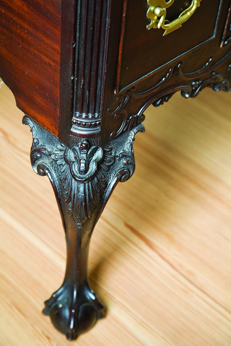 The cabriole legs, claw-and-ball feet, as well as trefoil carving on the knees and blocks on this Courtenay piece are especially deep and vivid.