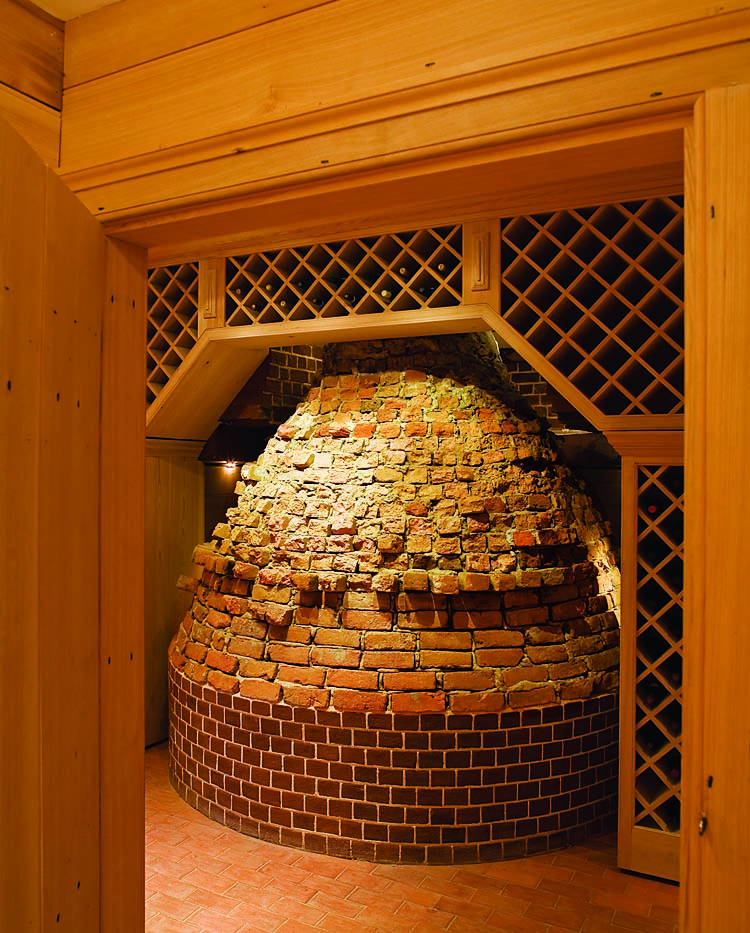 This early water cistern, dating to the period of John Cocke II, was unearthed during archaeological excavations for the new kitchen wing. Rather than demolishing this seemingly intrusive feature, which would come naturally to most homeowners, it was incorporated into the cellar and used as a backdrop for wine racks.