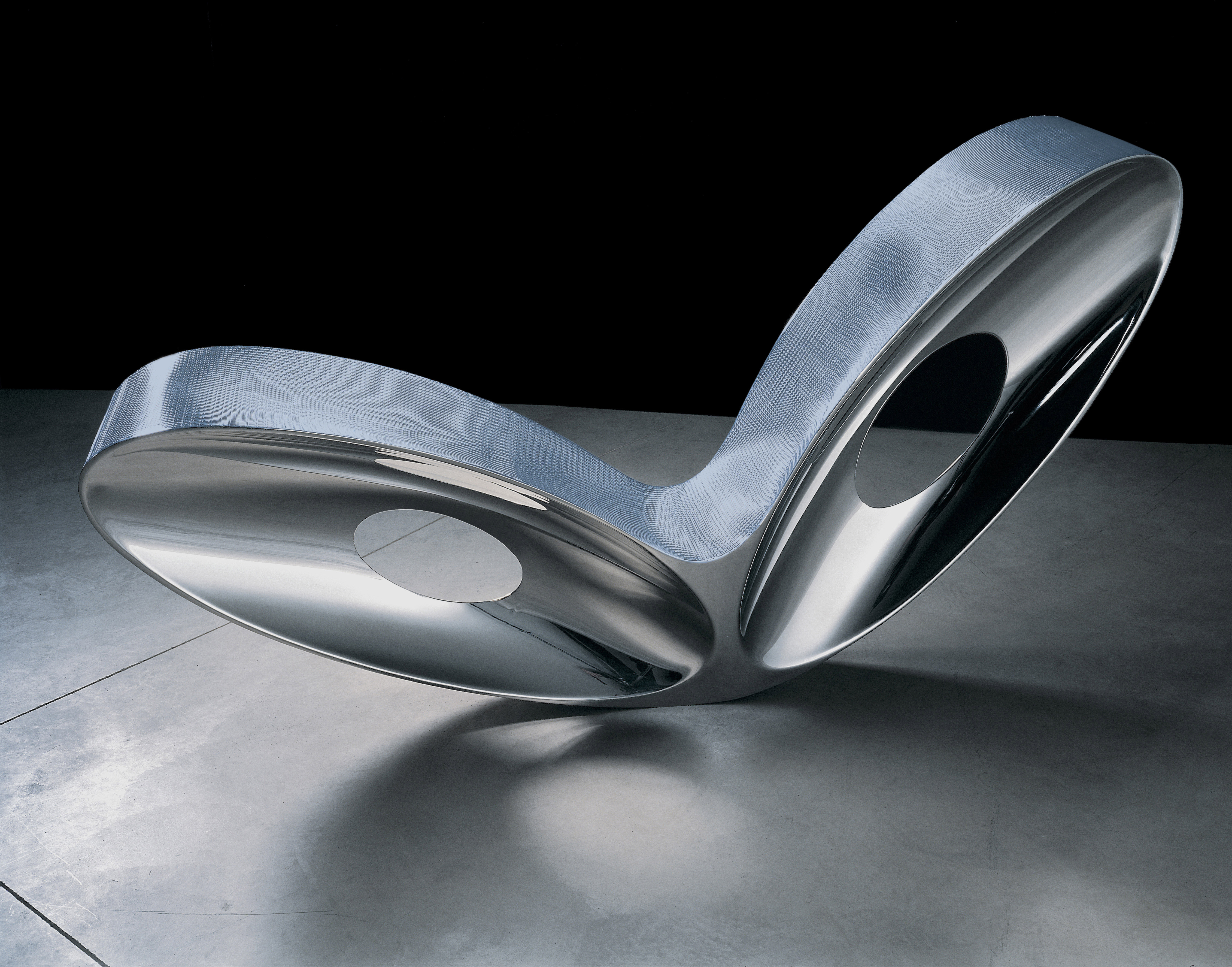 Blo-Void I, 2006, designed by Ron Arad, British, born Israel 1951; manufactured by Galerie Mourmans, Maastricht, Netherlands. Mirror-polished aluminum alloy and anodized woven-aluminum mesh, 40 x 80 x 17 inches. High Museum of Art, Atlanta, purchase through prior acquisition from Beth and Sam Scarboro in loving memory of Grace and Dewey D. Scarboro, and bequests of Kate Session Marsh and Mrs. Norman Powell Pendley.