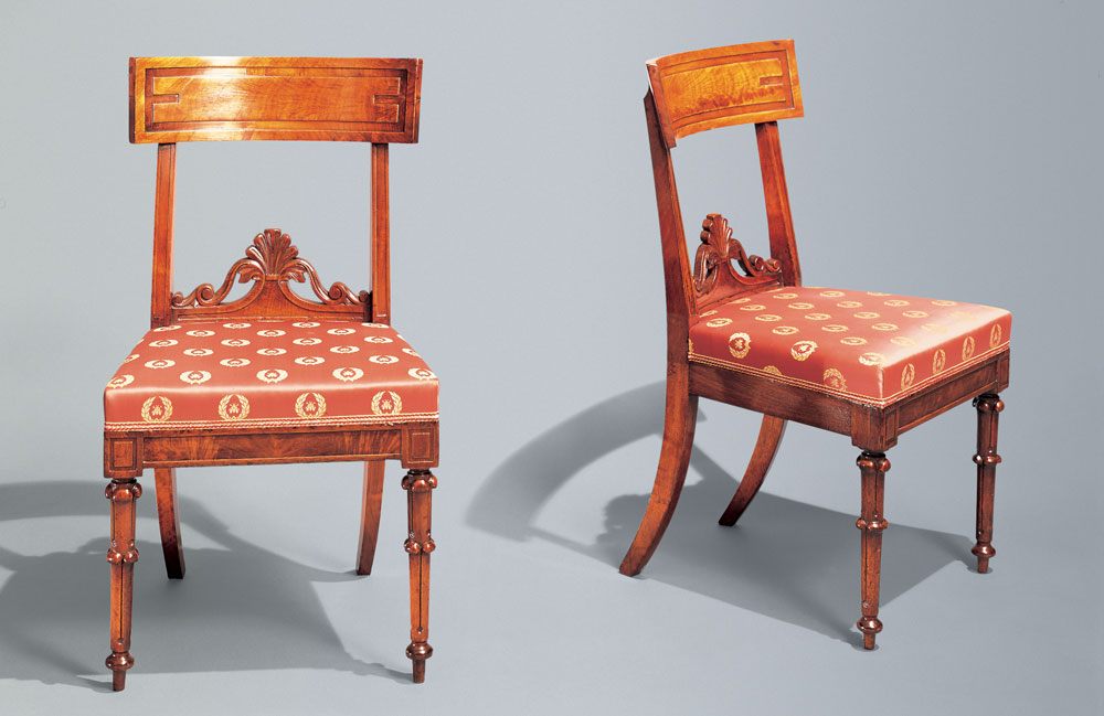 Mahogany Klismos chairs by Richard Parkin, Philadelphia, circa 1835. Two from a set of eight. H. 33, W. 18 in. Private Collection. Photography courtesy of Carswell Rush Berlin, Inc., New York. The Klismos form was to dominate chair design for forty years and, while several regionally distinctive designs emerged from Philadelphia, an 1835 example by Richard Parkin attests to the power of the style and the taste of the society for which they were made. Identical chairs to this set, in the Landis Valley Farm Museum in Lancaster, Pennsylvania, bear the paper label of Richard Parkin while at his Egyptian Hall address. The design is inspired by chairs made by Georges Jacob published in 1805 in Pierre de la Mésangère’s Collection de Muebles et Objets de Gout (Paris 1802–1835). Unlike Jacob’s design, the front legs of these chairs anticipate the Gothic Revival. An additional source of inspiration may have been plates 15–17 of Thomas King’s The Modern Style of Cabinet Work Exemplified (London, 1829). Combining French and English sources is a salient characteristic of American Classical furniture.