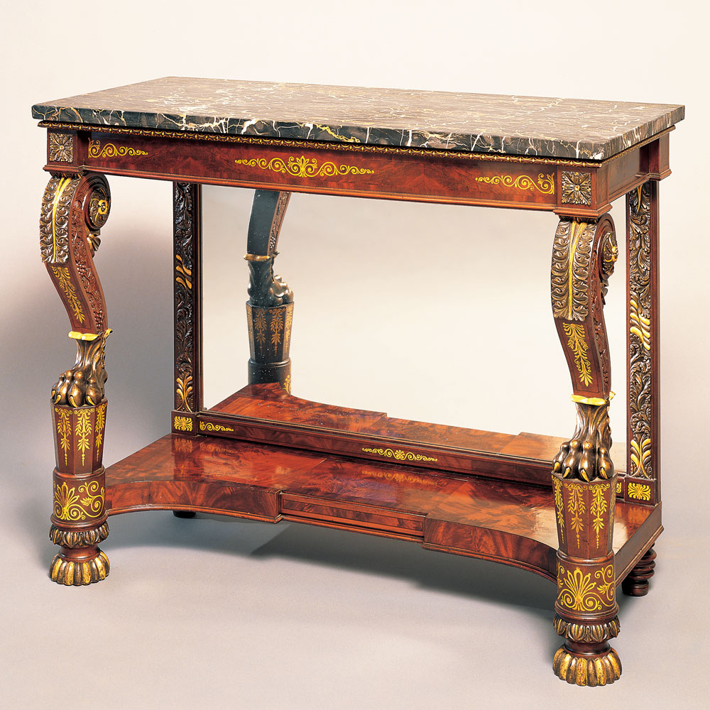 Carved, Gilt Stenciled and Bronze-Powder Paint Decorated Mahogany Pier Table, Attributed to Anthony G. Quervelle, Philadelphia, circa 1825–1830. H. 38˙ W. 47˙, D. 22 in. Private collection. Photography courtesy of Carswell Rush Berlin, Inc., New York. Emigrating from France in 1817, Anthony Quervelle’s influence on Philadelphia furniture seems to have been so pervasive that his style has become synonymous with Philadelphia classical furniture, much like Duncan Phyfe’s has with New York furniture from the same period. Characteristic of Quervelle’s work is fine grape vine carving, gadrooning and a sophisticated combination of stencil and bronze-powder paint decoration as exhibited in this masterpiece pier table, similar to those he made for the White House in the Jackson administration.7 The scrolled legs terminating in animal paw feet reference Greek and Roman furniture such as tripod stands and candelabra bases seen in Piranesi’s work and in archeological architectural drawing published in London by Charles Heathcote Tatham in 1799. This scrolled leg defined the style of the French Restauration, popular in America between 1830 and 1840.