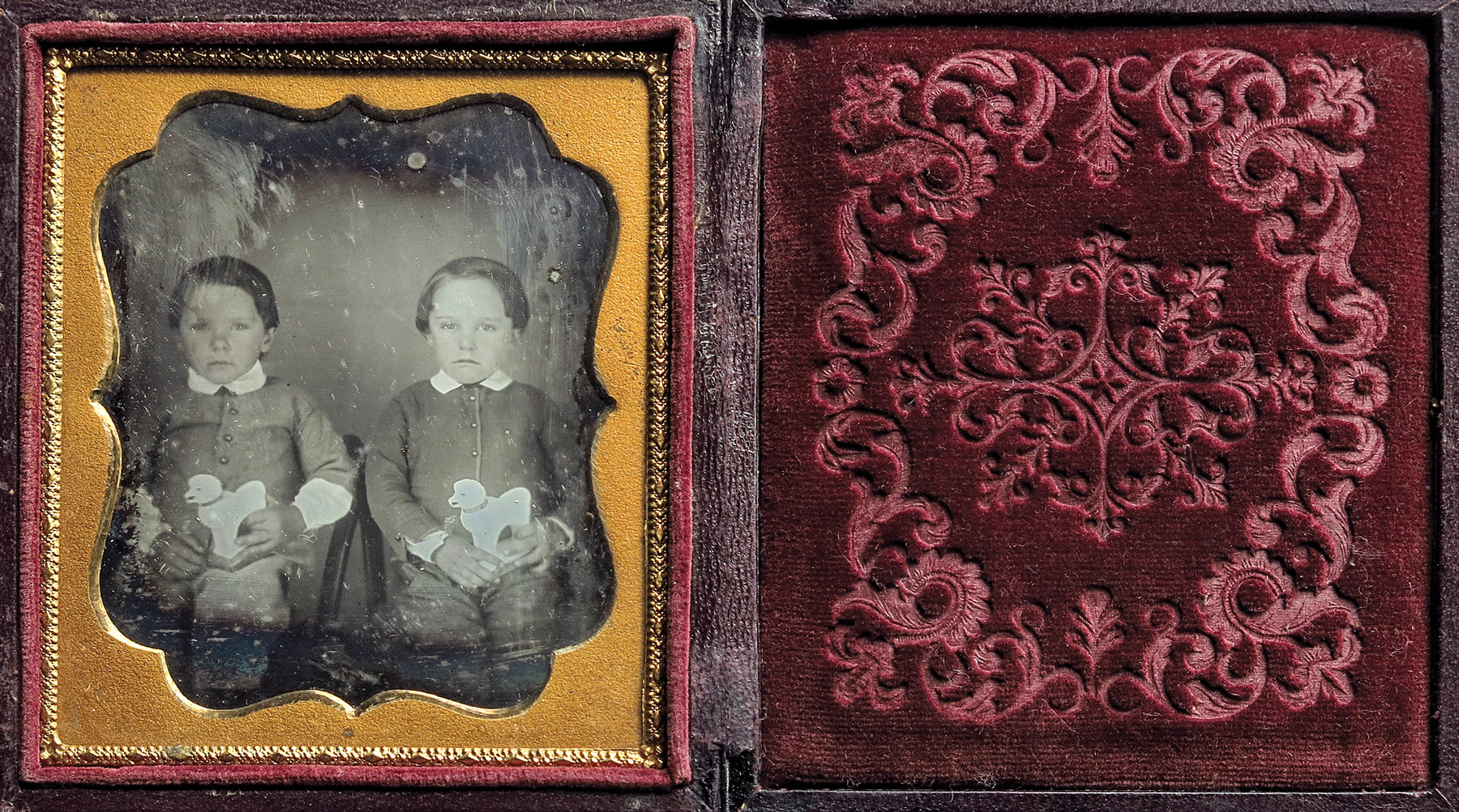 Twins Holding Toy Dogs, unknown daguerreotypist, ca. 1845. Sixth-plate daguerreotype. Photography by John M. Miller.