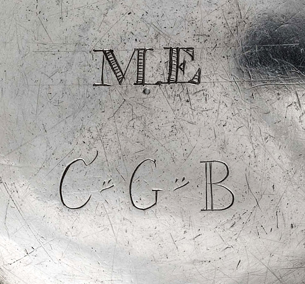 Fig. 11: Detail of initials on base of unmarked teapot shown in fig. 8, right.