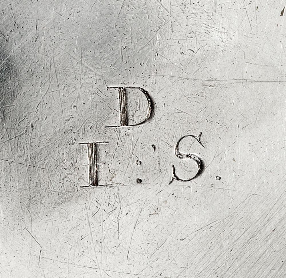 Fig. 2: Detail of initials on base of tankard in fig. 1, right.