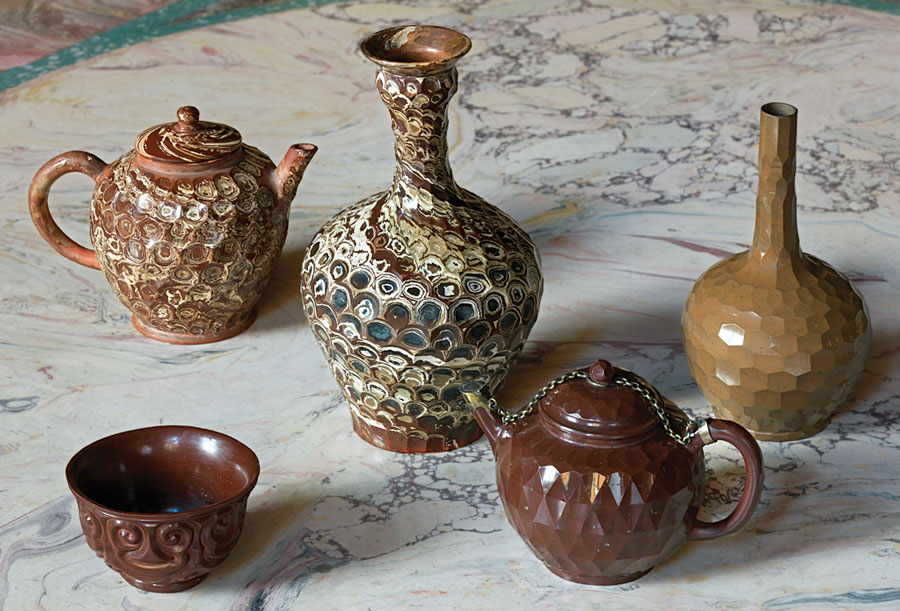 A selection of Böttger stoneware, Meissen, circa 1710–1715. Marbleized Meissen with “carved” glyptics is quite rare. Contemporary sources describe the ware as “jasper porcelain.” They were probably presents from Augustus the Strong of Saxony to Sibylla Augusta, whom he greatly admired. Photography by Martine Beck Coppola.
