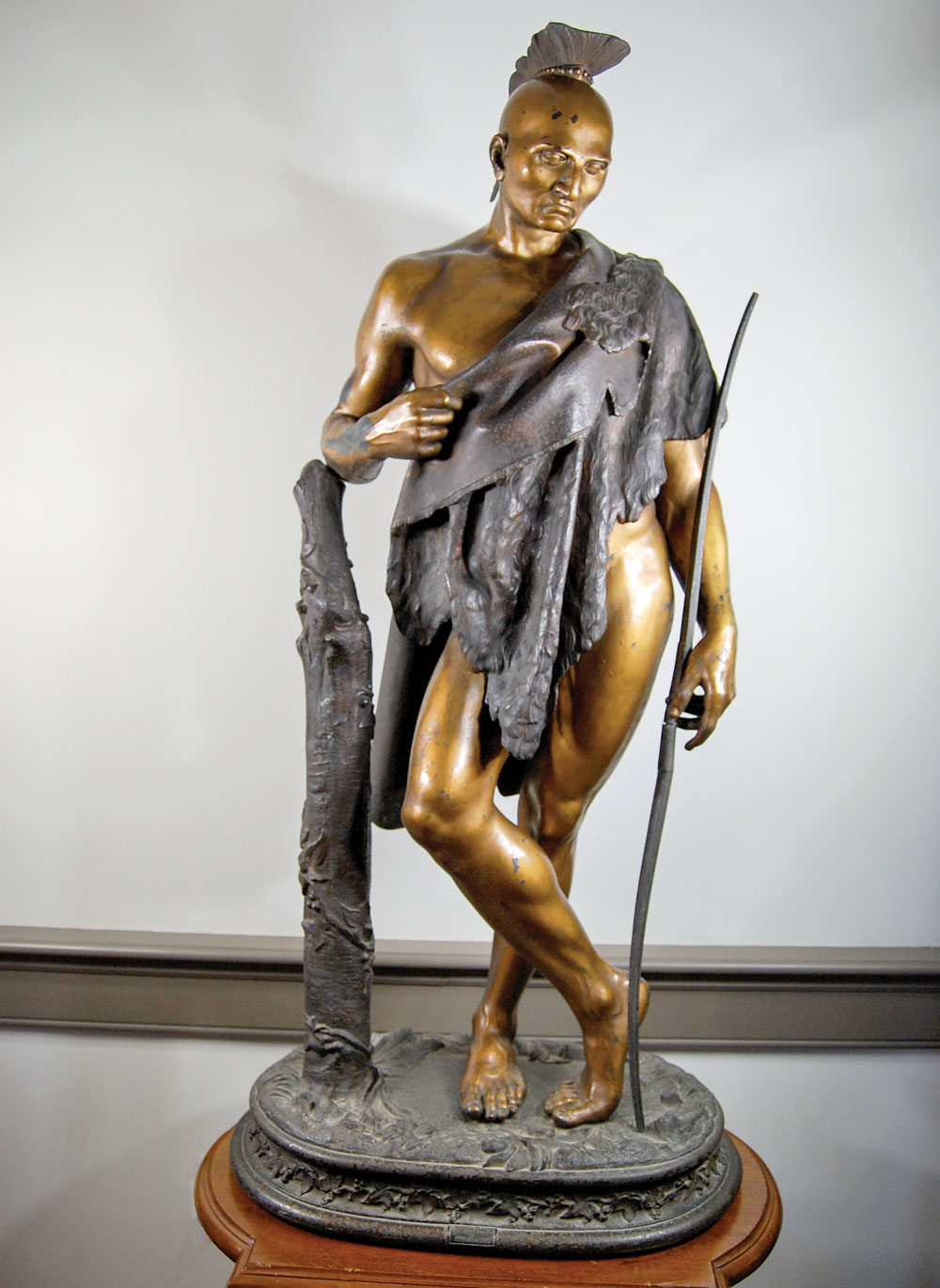 Fig. 10: The Indian, by Cornelius & Baker, Philadelphia, ca. 1858–1859. Bronzed and gilt zinc. H. 42¾ in. The original design was created by William H. Rinehart (1825–1874) and cast in bronze by Cornelius & Baker as a companion to “The Hunter” in fig. 9. It stands to the proper left side of the monumental clock in the Hall of the House of Representatives in the United States Capitol. This example is one of the few subsequently cast in zinc by Cornelius & Baker for sale to the general public. Private collection.