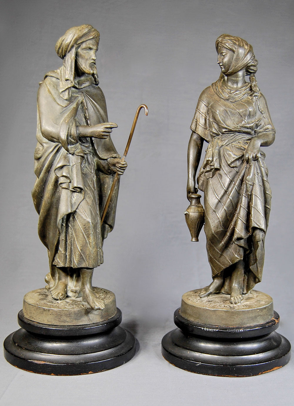 Fig. 12: Rebekah and Eliezer, by Cornelius &Baker, Philadelphia, 1855–1865. Bronzed zinc, wood. H. 14 in. each. Cornelius & Baker drew inspiration for these figures from the Bible (the Book of Genesis, chapter 24, verses 1–67). They depict the moment when Eliezer, seeking a wife for his master’s son, Isaac, meets Rebekah at a well and asks her for a drink of water, as a test to determine if she was of a suitably generous nature to be Isaac’s wife. Private collection.