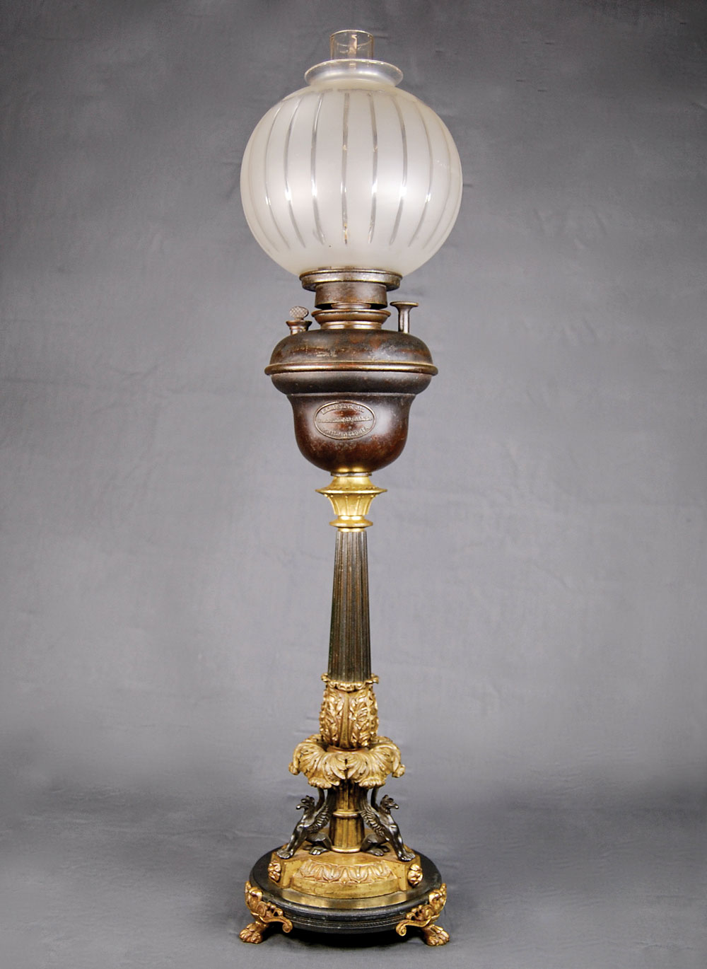 Fig. 7: Kerosene lamp made by Cornelius & Baker, Philadelphia,1858–1869. Bronzed and gilt brass, glass, iron. H. 28 in. Cornelius & Baker first exhibited kerosene lamps at the Franklin Institute’s twenty-sixth exhibition of American manufactures in 1858. Private collection.