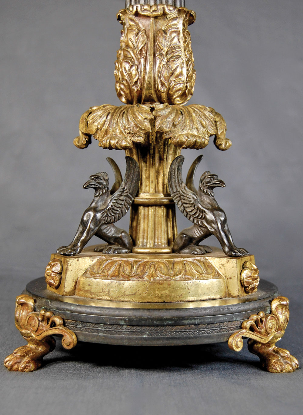 Fig. 8: Detail of the kerosene lamp in fig. 7, showing the acanthus leaf canopy over seated winged griffins. Adapted from ancient Greek design, both features had been favored motifs in European and American design since the mid-eighteenth century.
