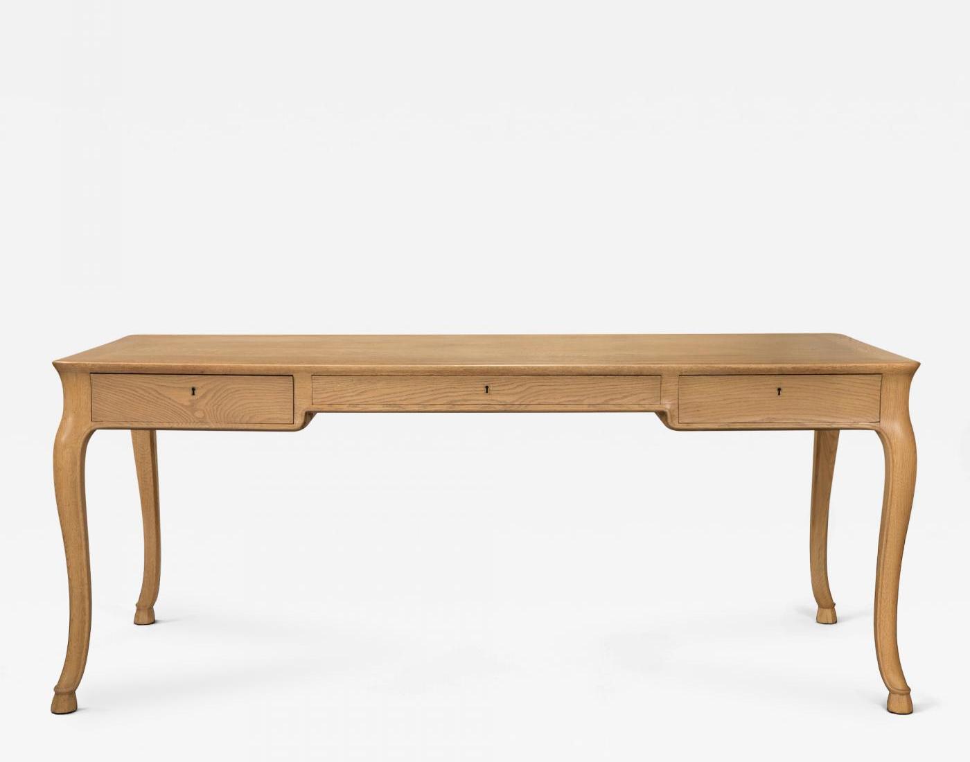 A large Danish elm and oak writing table by Frits Henningsen, circa 1950. Offered by H.M. Luther.