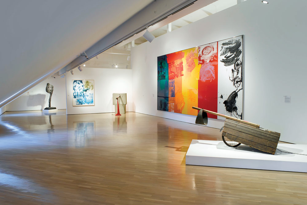 Installation of works by Armando (Dutch, b. 1929) and Robert Rauschenberg (American, 1925–2008). Left to right: Armando’s bronze Flag 2, 1988; Rauschenberg’s Untitled (Early Egyptian series), 1973; Tabernacle Fuss (Urban Bourbon series), 1992; Empire I (Combines series), 1961; and Intermission (Ground Rules series), 1996. Photography Paul Kirschner.