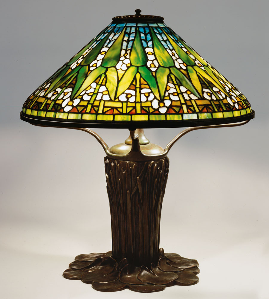 Fig. 5: Arrowhead shade, designed by Clara Driscoll circa 1904, model 1496. Diam: 20 in. Cattail Pond Lily base, designed pre-1905, model 225. The New-York Historical Society, gift of Dr. Egon Neustadt. Photography by Glenn Castellano.