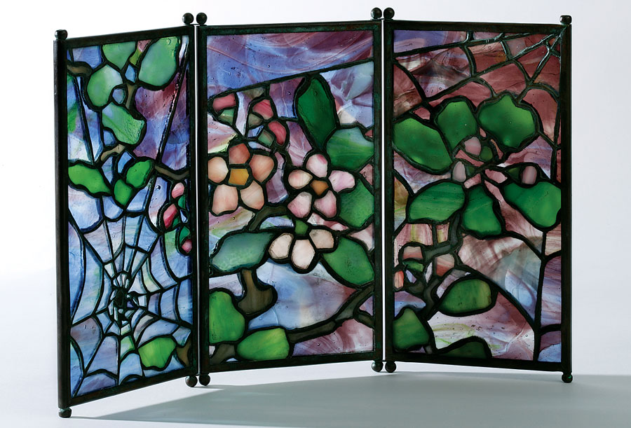Fig. 6: Tea screen with apple blossoms and cobwebs, probably designed by Clara Driscoll pre-1906. Bronze and glass. H. 7˙, W. 12˙ in. Private collection. Courtesy of Lillian Nassau LLC, NY. Photography by Glenn Castellano.
