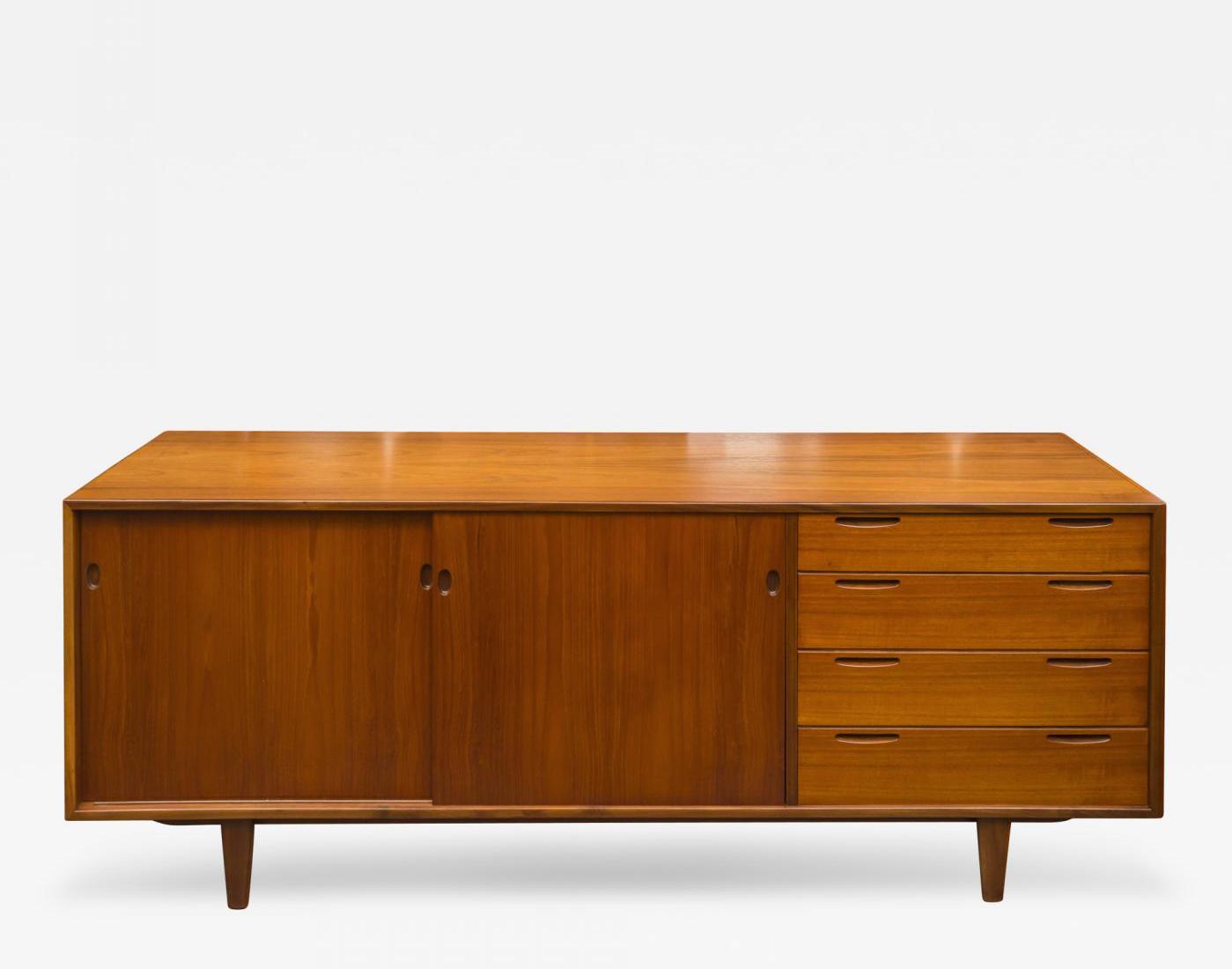 Description Ib Kofod-Larsen design danish modern teak credenza with adjustable shelves and fitted drawers, circa 1950s. Offered by De Angelis.