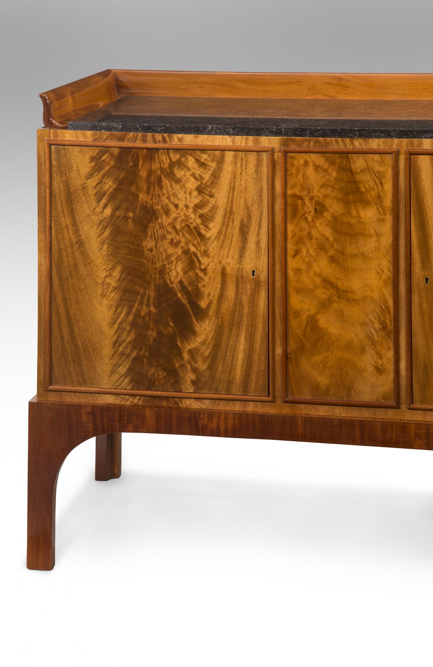 An Important Cuban Mahogany Cabinet, Kaj Gottlob for AJ Iversen, 1929. Cuban Mahogany, Marble, W. 77.5, 36.25, D. 23.25 inches. Offered by H.M. Luther.