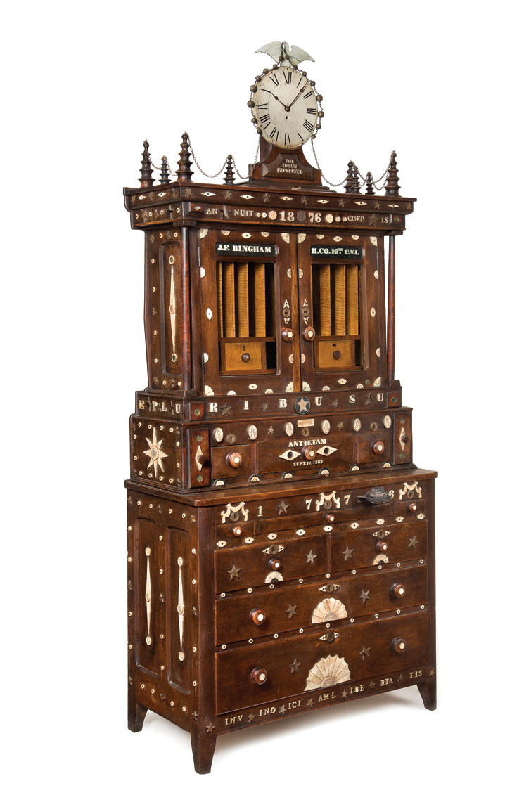Fig. 6: The Bingham Family Civil War Memorial Secretary, Connecticut, dated 1876. Walnut, oak, ebony, poplar, pine, and maple. Other materials incorporated are metal, glass, muslin, silk, bone, horn and abalone. H. 95 1/2, W. 42 1/4, D. 19 3/4 inches. Image courtesy of Allan Katz Americana.