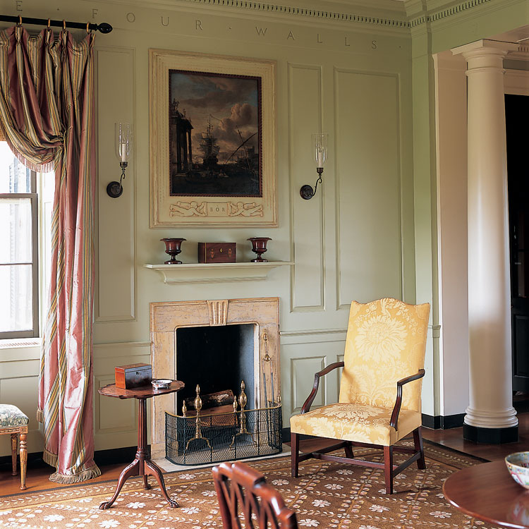 Randolph Ortman’s initials are carved into the chimney breast frame of the original overmantel painting, signed by Abraham Storck (1635–1710). The early nineteenth-century lolling chair, next to an Irish candlestand, is a form often seen from coastal Massachusetts.