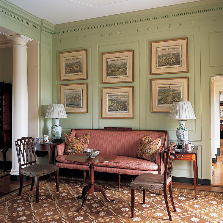 A corner of the music room has a series of Johannes Kip’s (1653–1722) views of British country houses above a New York sofa of about 1800 attributed to the partnership of Abraham Slover and Jacob Taylor. The sofa was the first piece of important Federal furniture the couple acquired; its purchase impelled the collection toward a Federal aesthetic. New York is also the origin of the Pembroke table on the left; the Pembroke table on the right was made in Baltimore. The chairs with “Gothic” tracery back splats have tassel carving associated with Samuel McIntire (1757–1811) of Salem, Massachusetts.