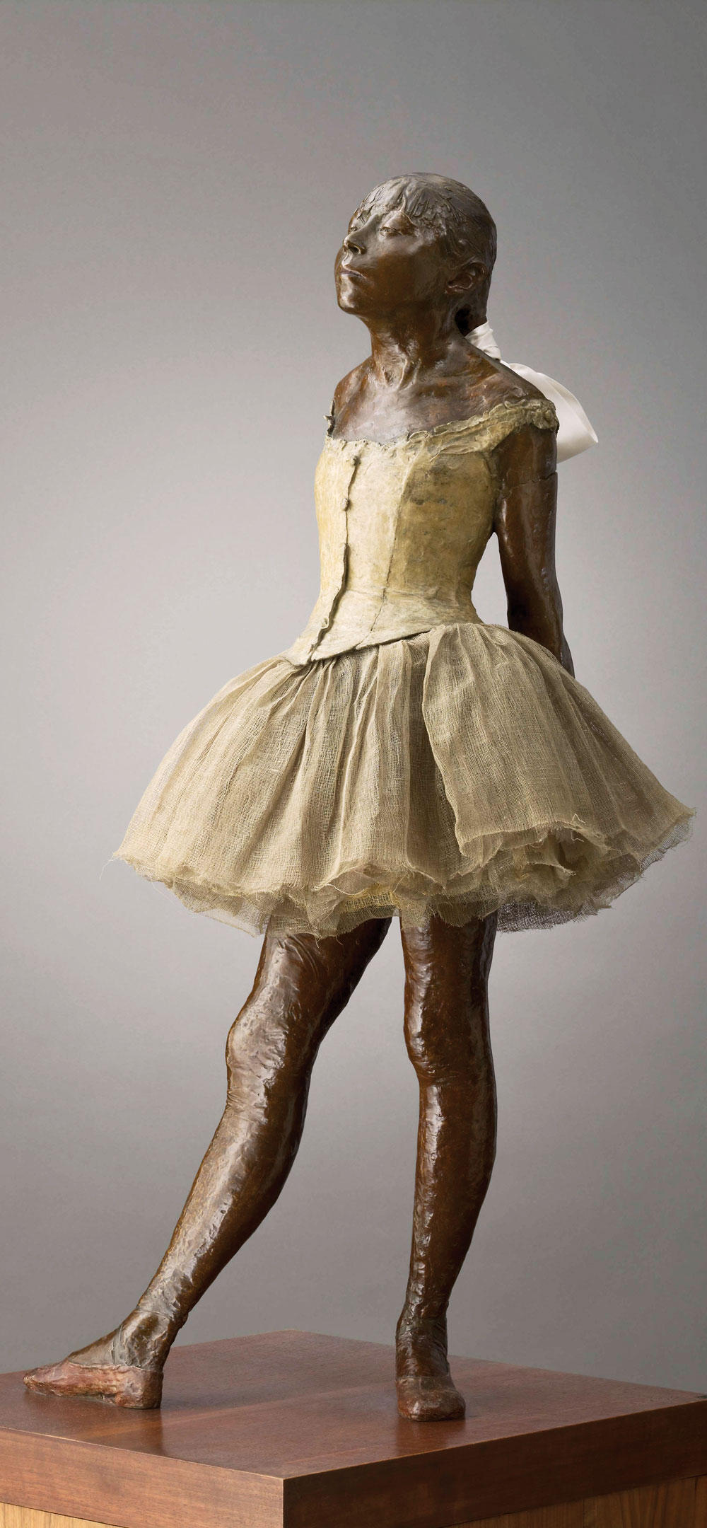 Fig. 7: Edgar Degas (1834–1917), Little Dancer Aged Fourteen, 1879–1881. Bronze, with gauze tutu and silk ribbon, on wooden base, H. 39 inches Sterling and Francine Clark Art Institute, Williamstown, Massachusetts. Photography by Michael Agee
