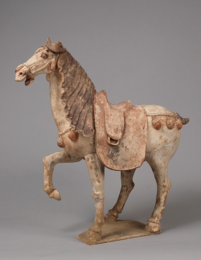 Figure of a Prancing Horse. Tang Dynasty (618 – 907). Earthenware with pigments. Height: 25 ¼ inches (64 cm). Courtesy of Berwald Oriental Art.