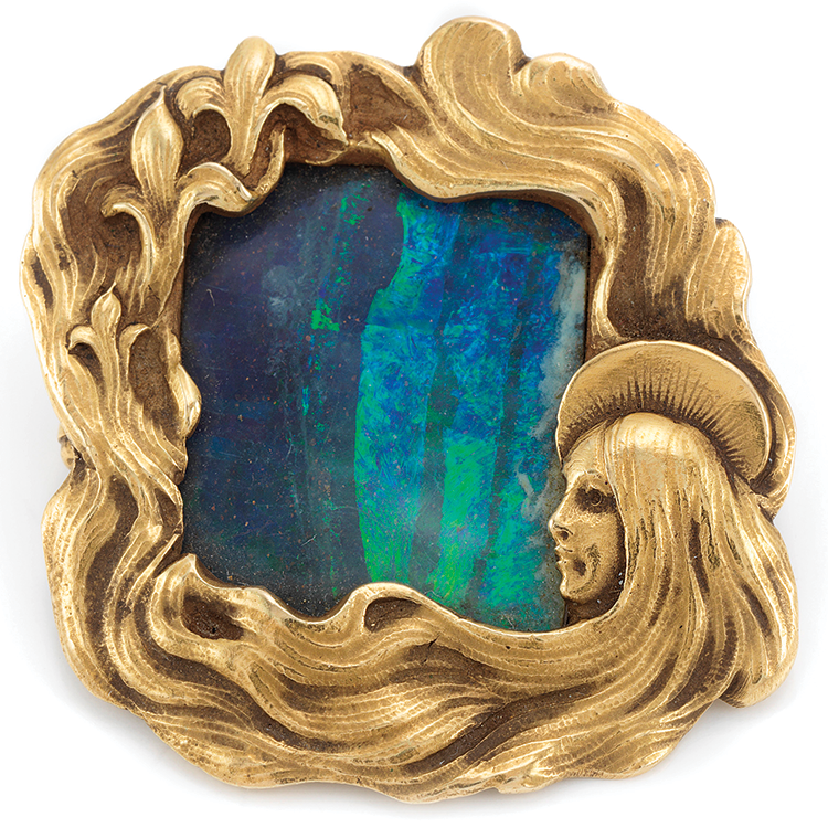 Fig. 12: Brooch, designed by F. Walter Lawrence (1864–1929), and probably made by Gustav Manz, b. Germany (1865-1946), ca. 1900. Opal, gold. Collection of Janet Zapata.