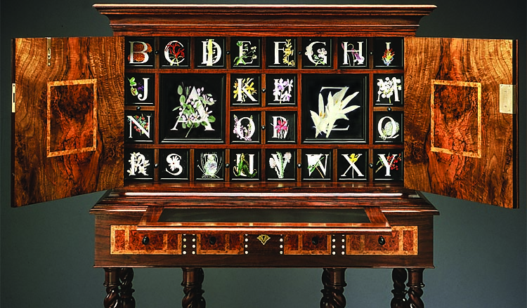 Fig. 3: Miguel Gómez-Ibáñez (b. 1949), interior of Escritorio (Alphabet Writing Desk), Boston, Massachusetts, 2008. Walnut, ebony, mother-of-pearl, Carpathian elm, oak burl veneer; botanical paintings by Joseph W. Reed; 56 x 42 x 19 inches. Collection of the artist. Photograph by Dean Powell.