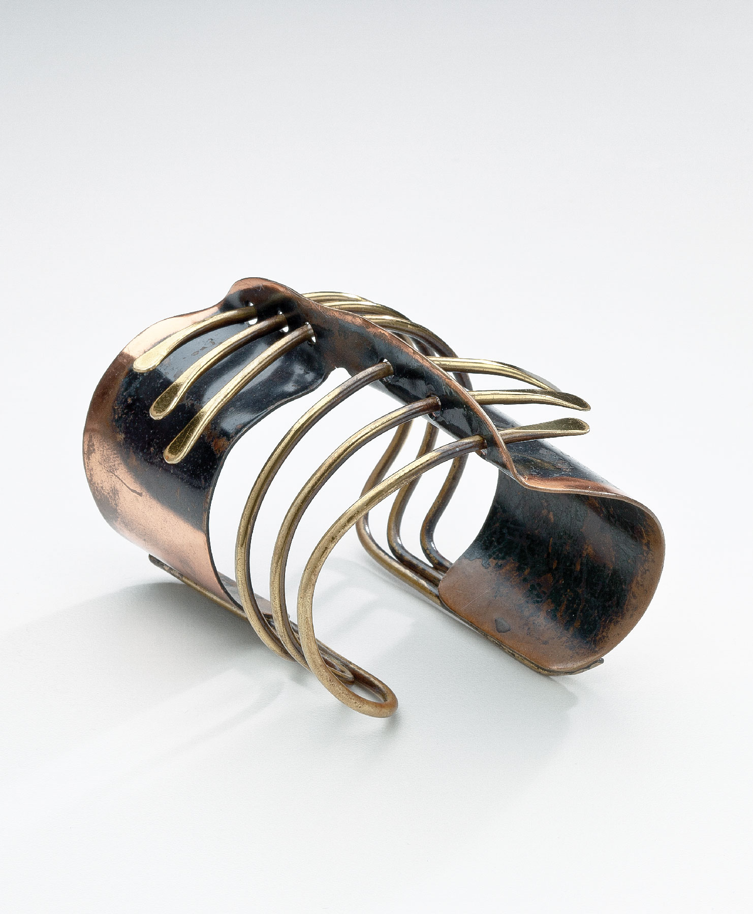 Fig. 13: Cuff bracelet, Art Smith (1917–1982), United States, ca. 1955. Copper, brass; 4⅛ x 2⅝ inches. Gift of Beth Green Olesky in memory of Hortense Kessler Green (2014 2014.30).