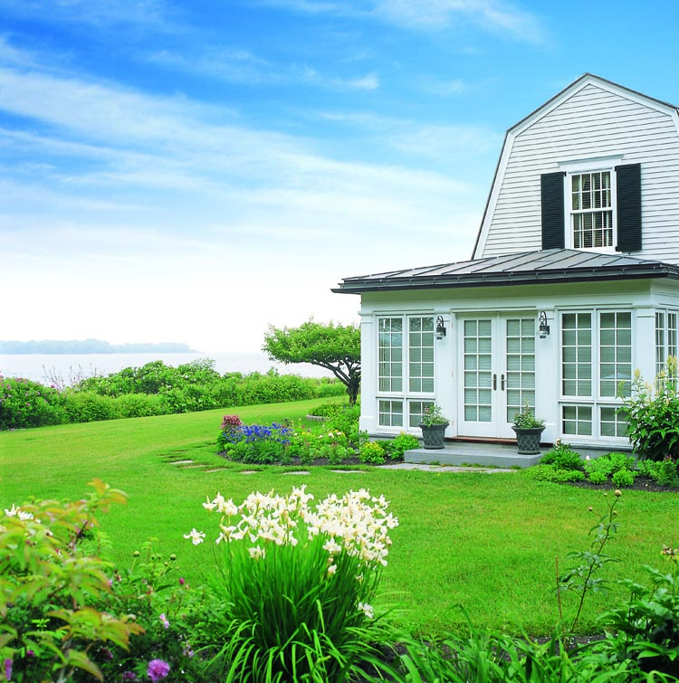 The house and gardens of this Maine retreat overlook one of the many inlets along Maine’s coast.