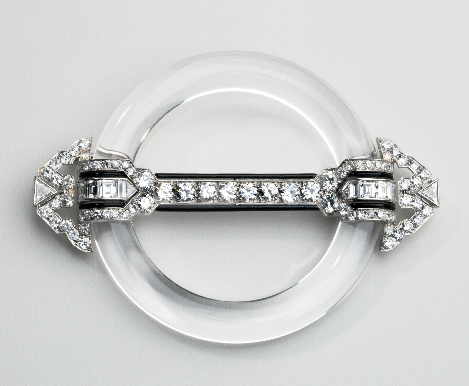 Fig. 6: Circle brooch, Tiffany & Co., New York, ca. 1925. Rock crystal, onyx, platinum, diamonds; 2¼ x 3 inches. Purchase 2011; Membership Endowment Fund and Friends of the Decorative Arts (2011.3).