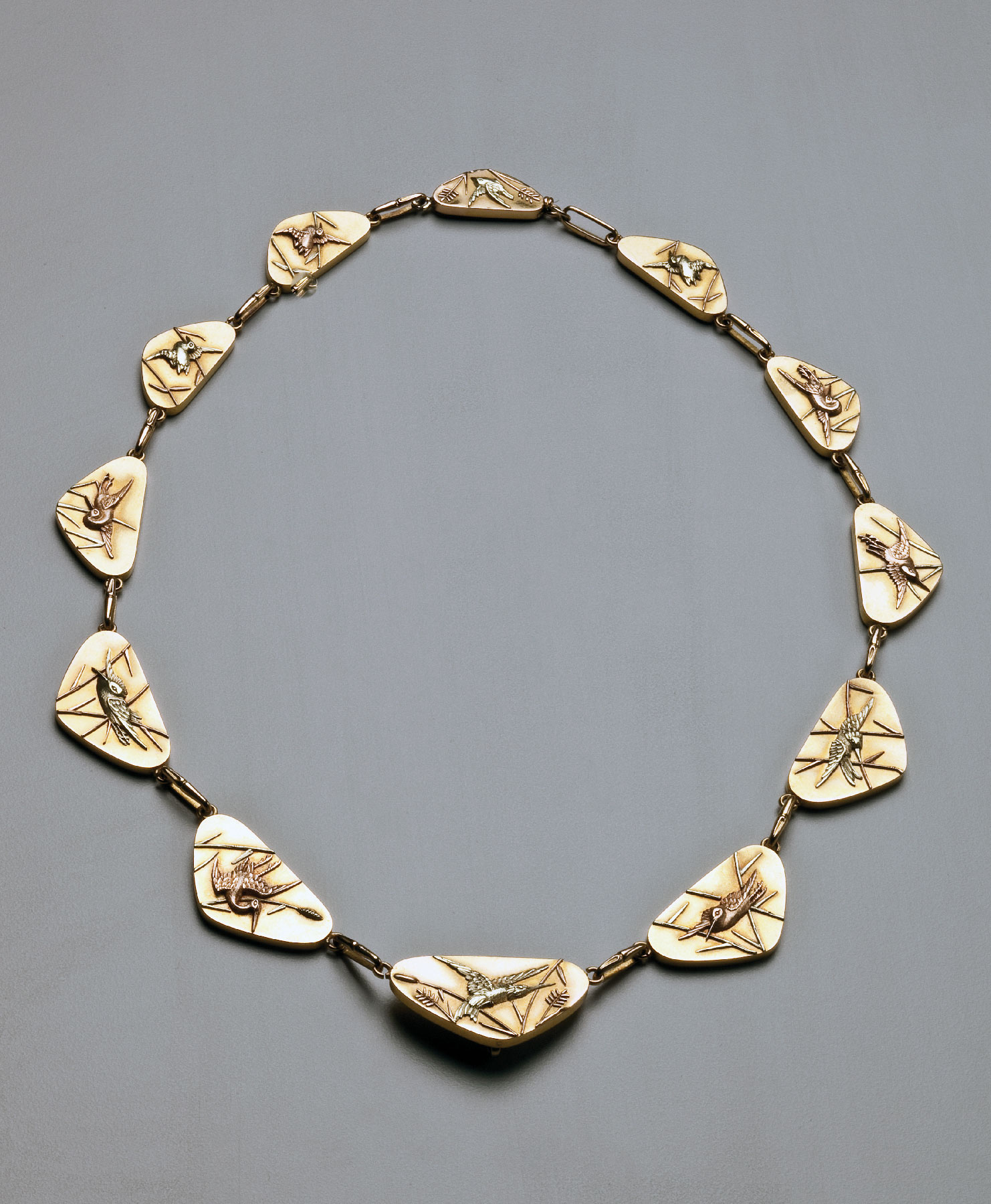 Fig. 7: Japanese style necklace, Tiffany & Co., United States, ca. 1878. Yellow, pink and green gold; 18⅛ (open) x ⅝ inches. Purchase 2009; Friends of the Decorative Arts and the Helen McMahon Brady Cutting Fund (2009.5.4).