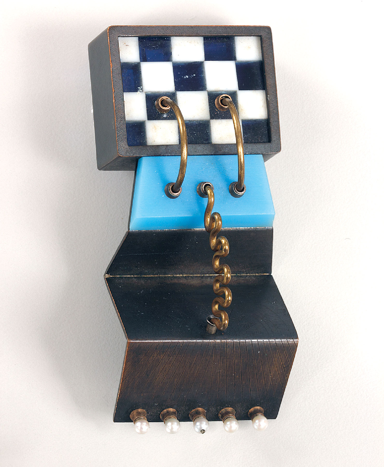 Fig. 9: Robert Ebendorf, United States, Colored Smoke Machine, 1974. Plastic, silver, brass, pearls; 3 x 1⁵⁄¹⁶ x ¹⁵⁄¹⁶ inches. Purchase 2012; Wallace M. Scudder Bequest Fund (2012.12.2). Robert Ebendorf is one of the originators of the use of found materials in jewelry making. Here traditional metalsmithing is combined with the use of industrial plastics.